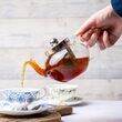 Pimclico Teapot pouring tea into a teacup