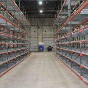 shelving down the aisle of a warehouse