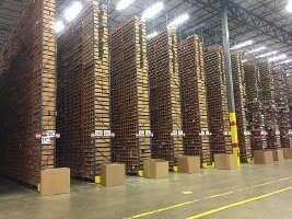 fully stacked warehouse with boxes and shelving