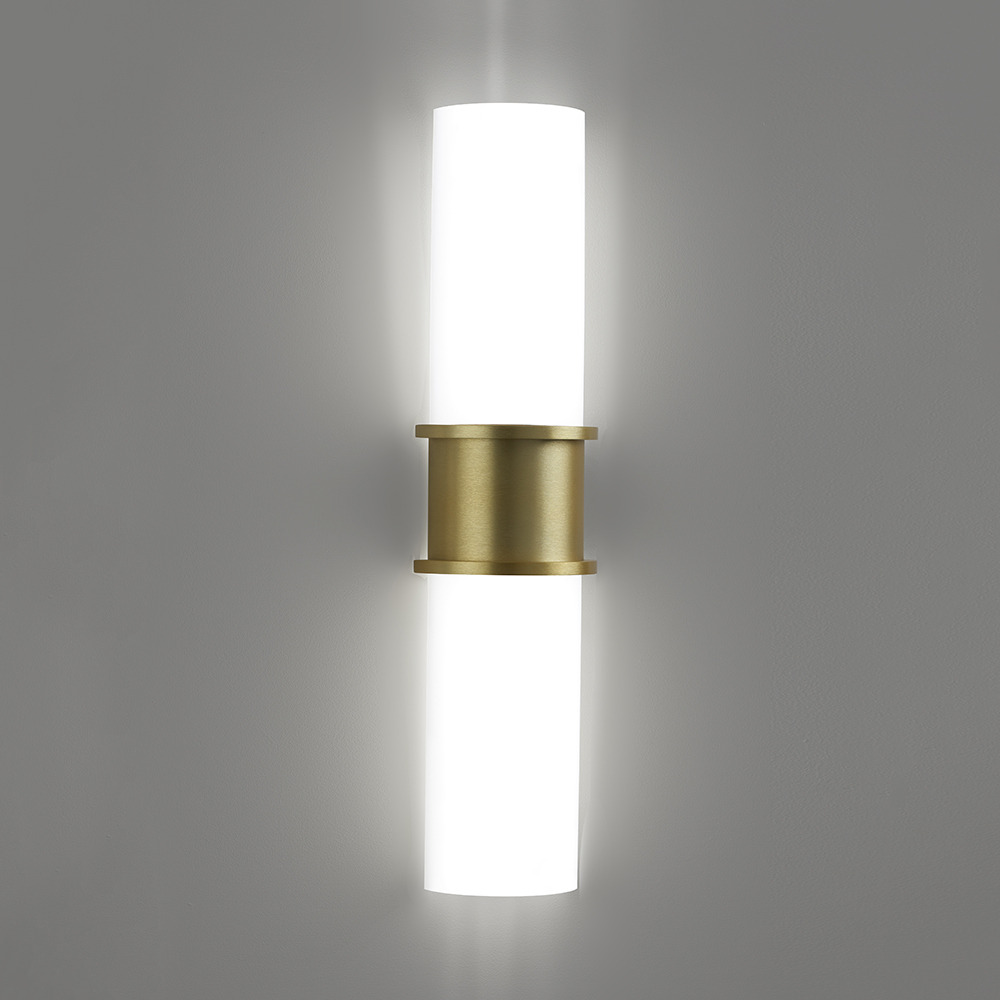 A large indoor wall sconce with luminous diffusers and a center accent 