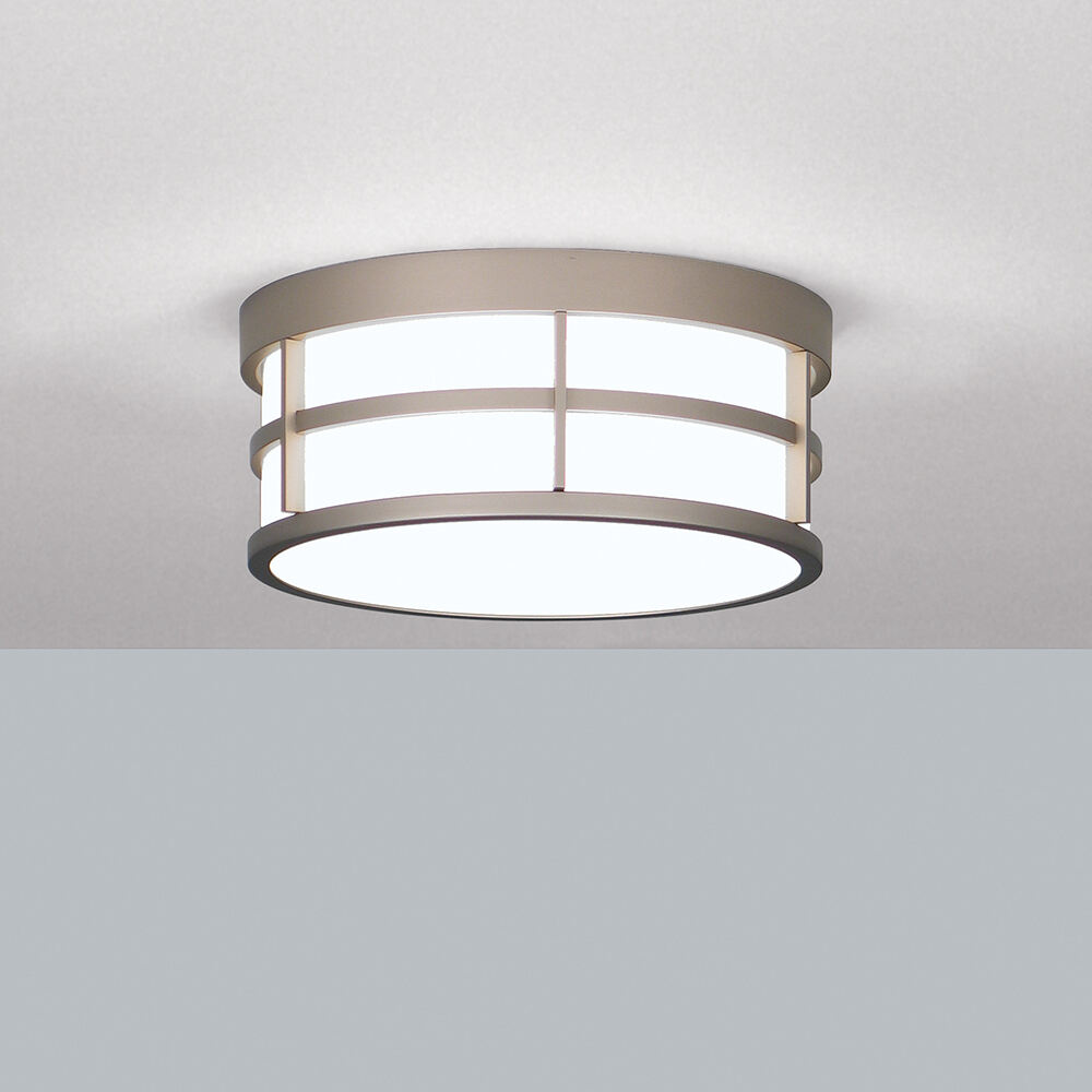 A ceiling-mounted drum luminaire with cross bar accents 