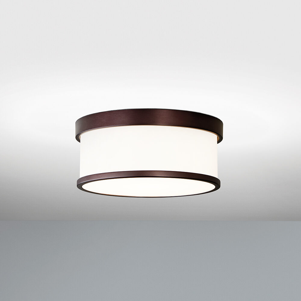 A ceiling-mounted drum luminaire with upper and lower solid rings