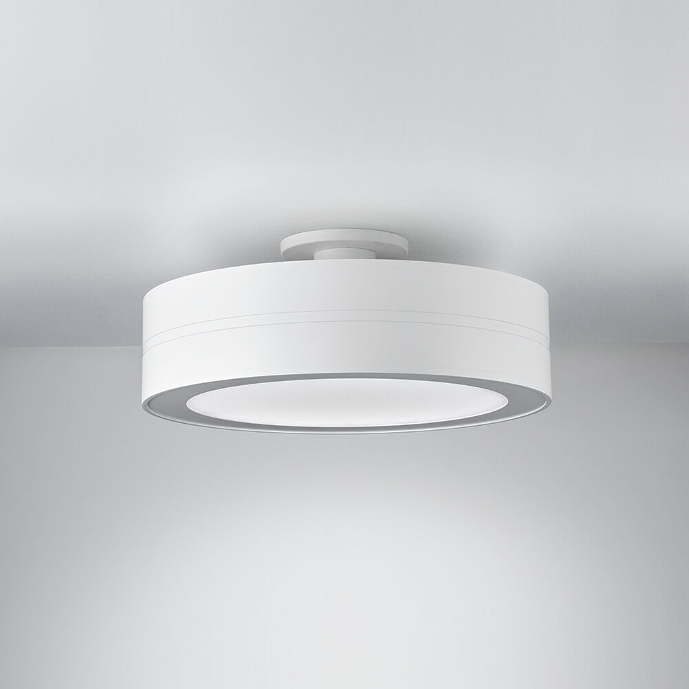 A ceiling-mounted drum luminaire with a light finish