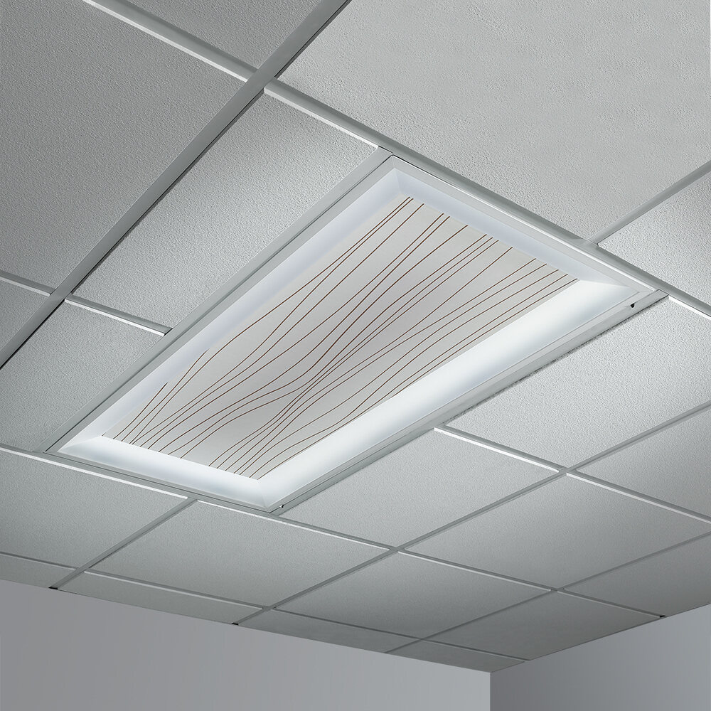 A 2x4 ceiling fixture with a patterned Lumicor diffuser and a luminous perimeter