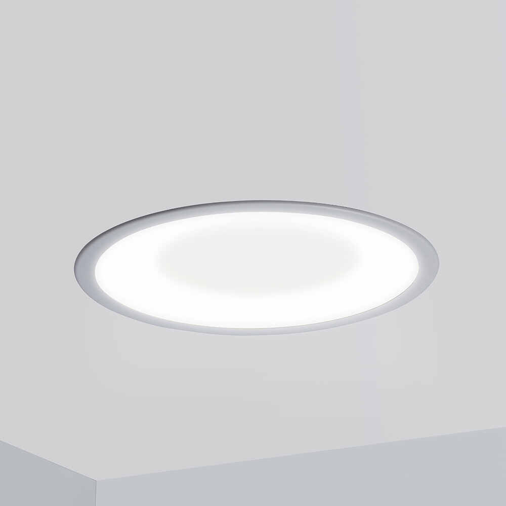 A round, recessed ceiling luminaire with a concave dome lens 