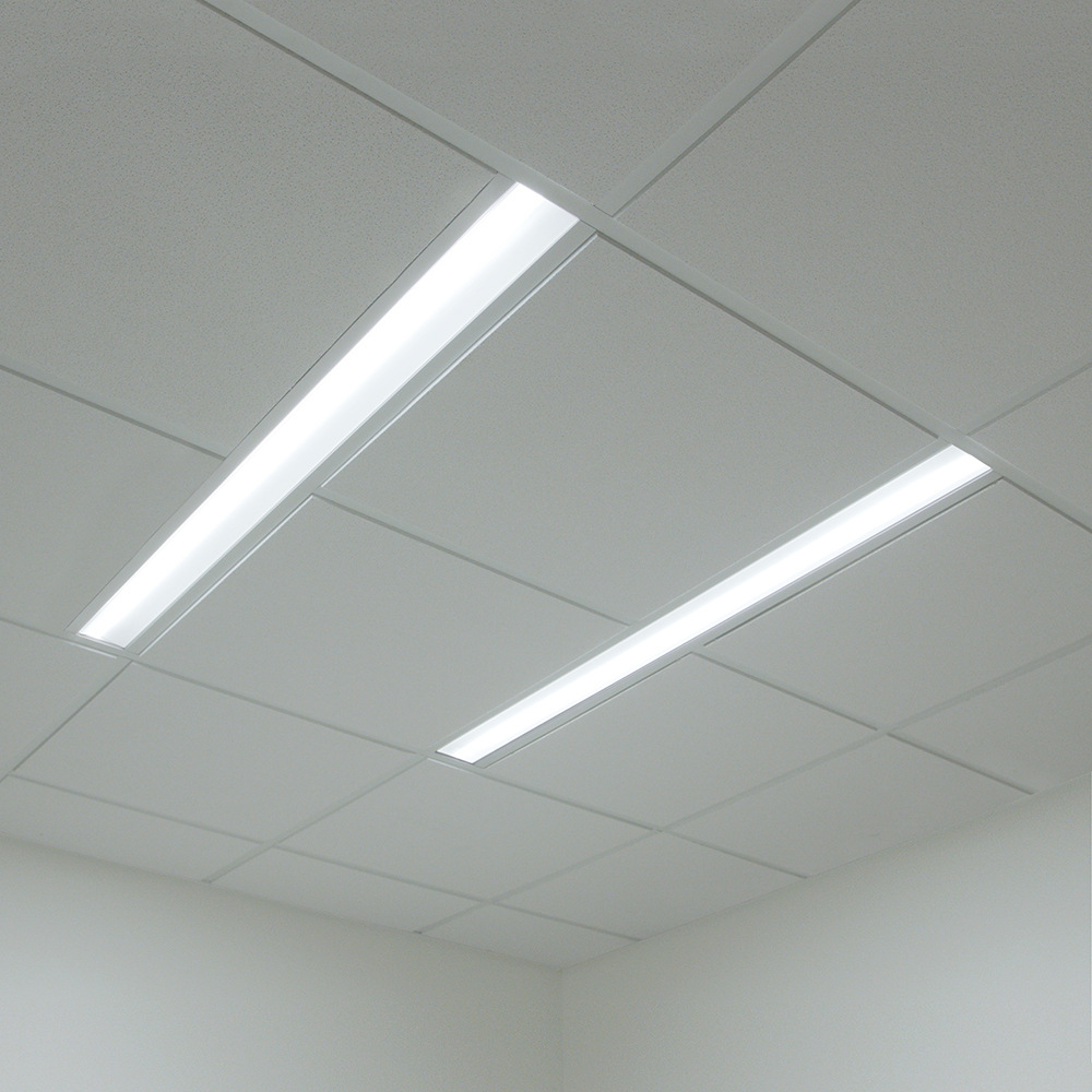 A thin, tunable dual unity overbed luminaire for patient lighting