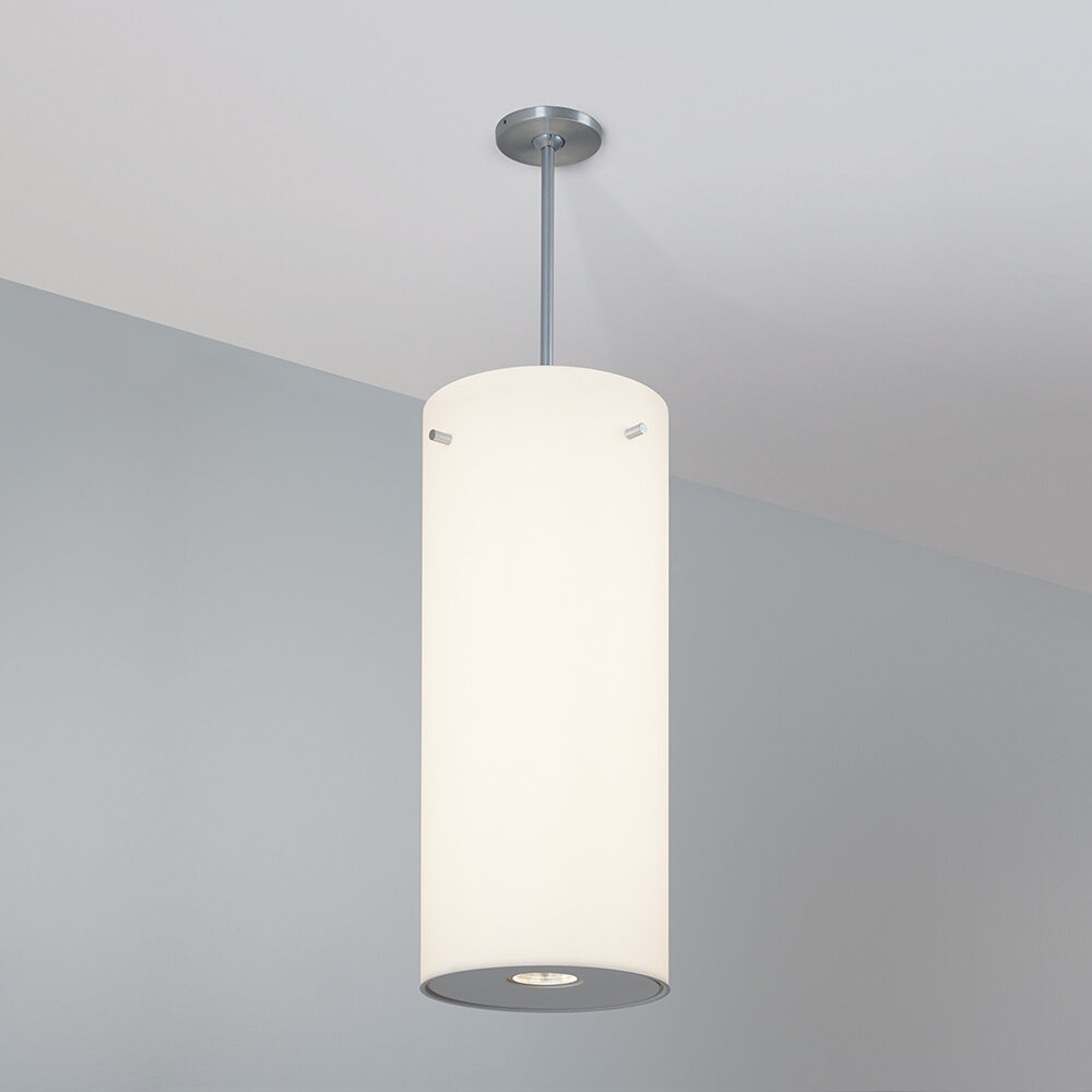 A large, luminous cylinder pendant with a pin accent
