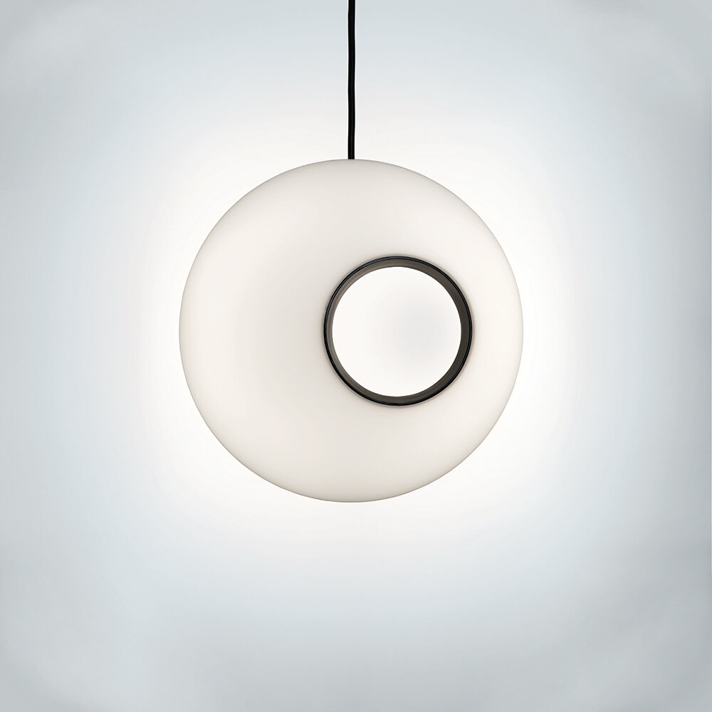 A spherical luminous pendant with a circular asymmetric hole 