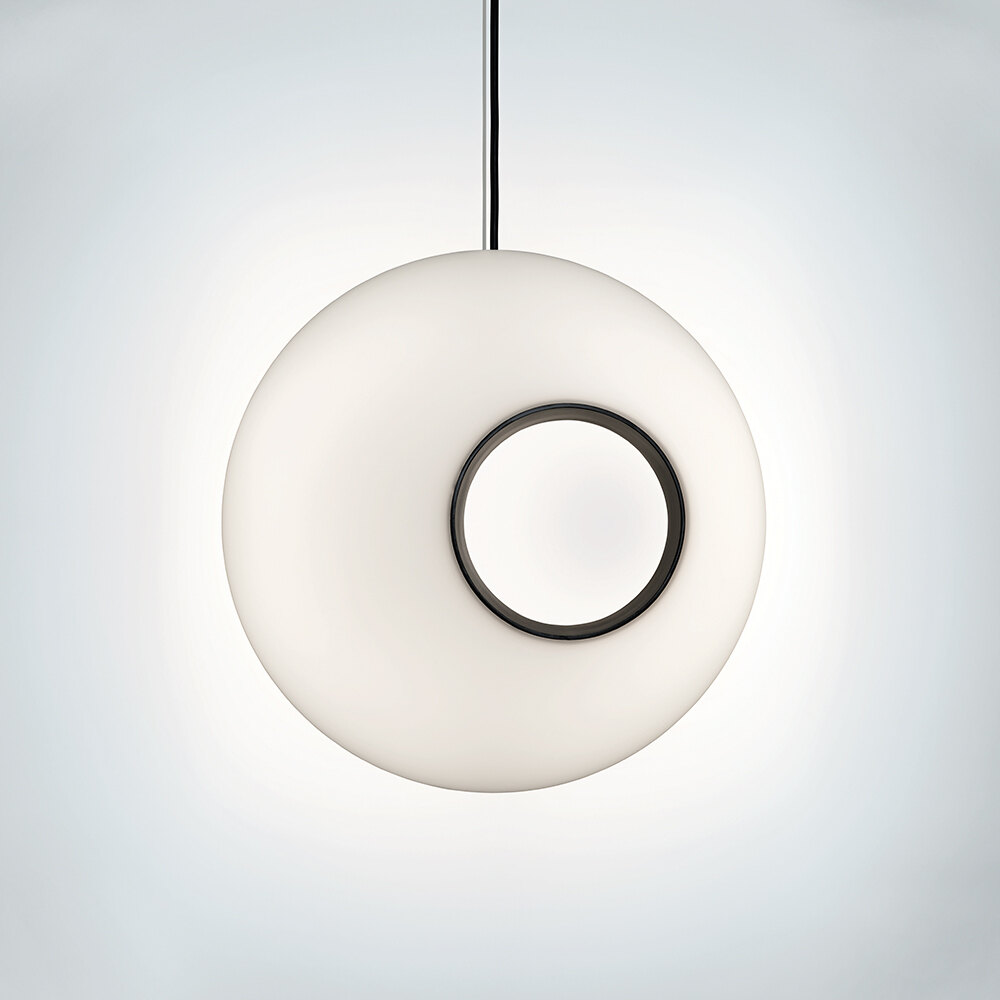 A spherical luminous pendant with a circular asymmetric hole 