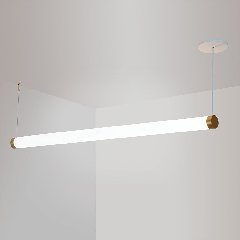 A thin, long, luminous cylinder pendant hung horizontally with cables