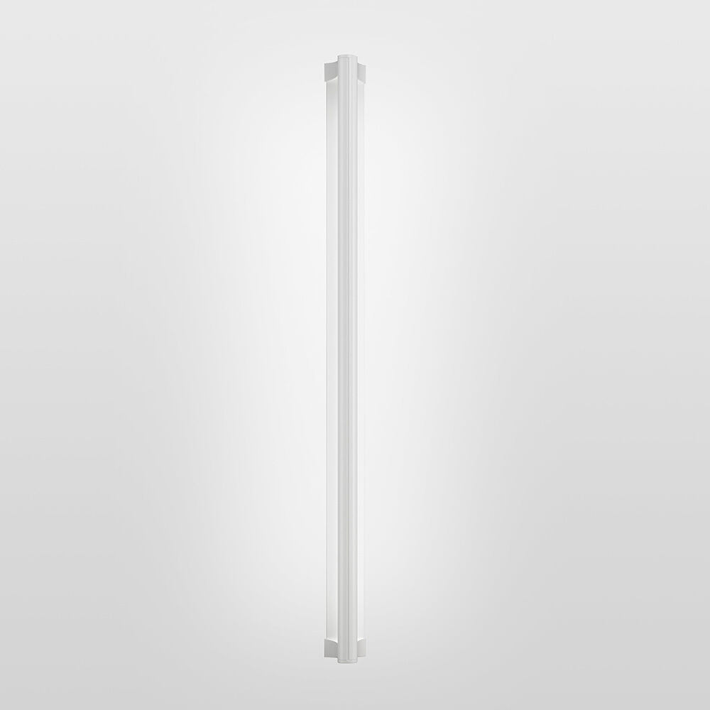 A surface mounted linear luminaire with a body that curves into the base with hidden indirect lighting