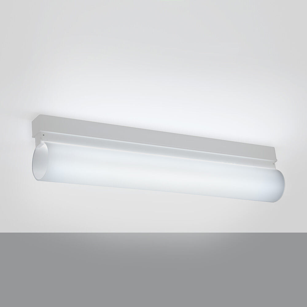 A thin linear surface-mounted luminaire with a fully luminous round body