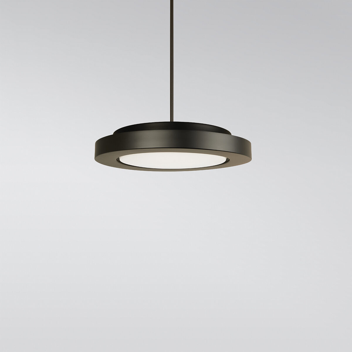 A circular pendant with a thick outer band, suspended by a stem