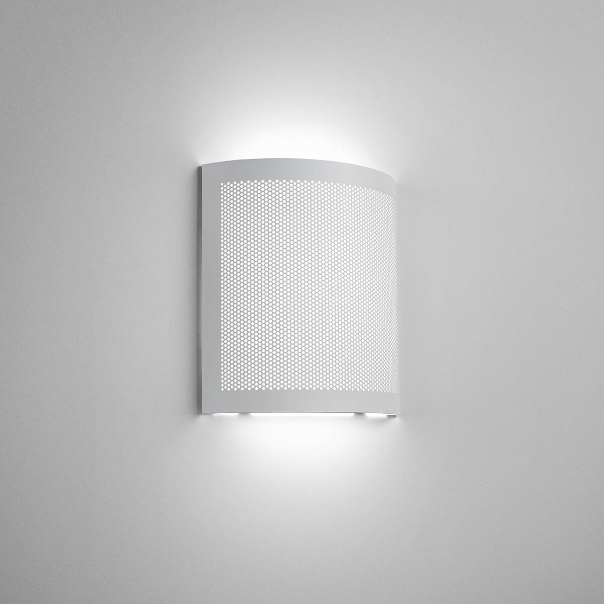 A square indirect wall sconce with a curved, perforated front plate