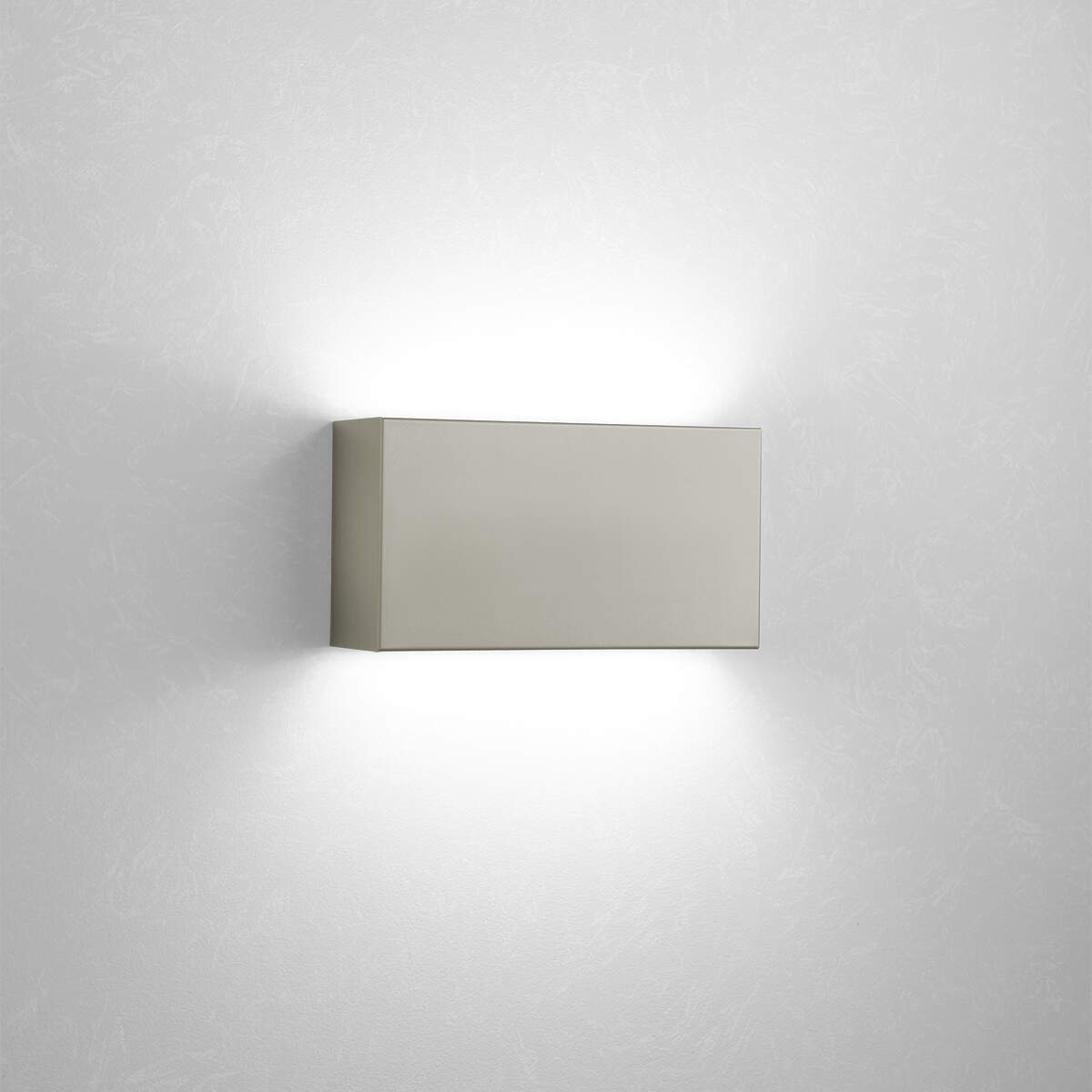 A box-like linear wall sonce with uplight and downlight