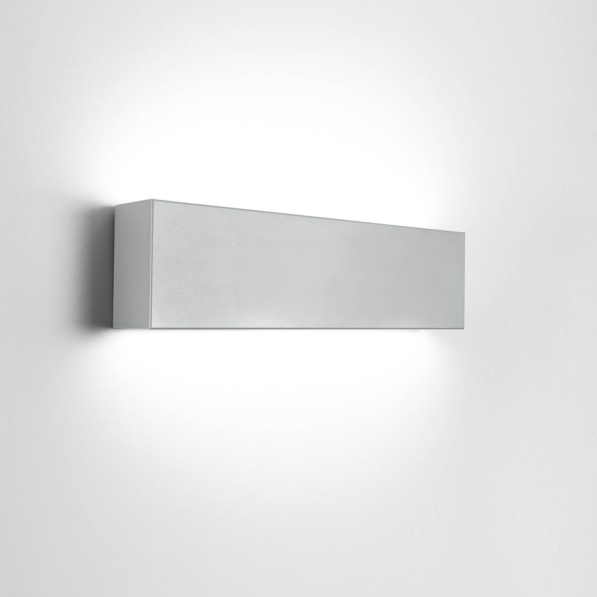 A box-like linear wall sonce with uplight and downlight