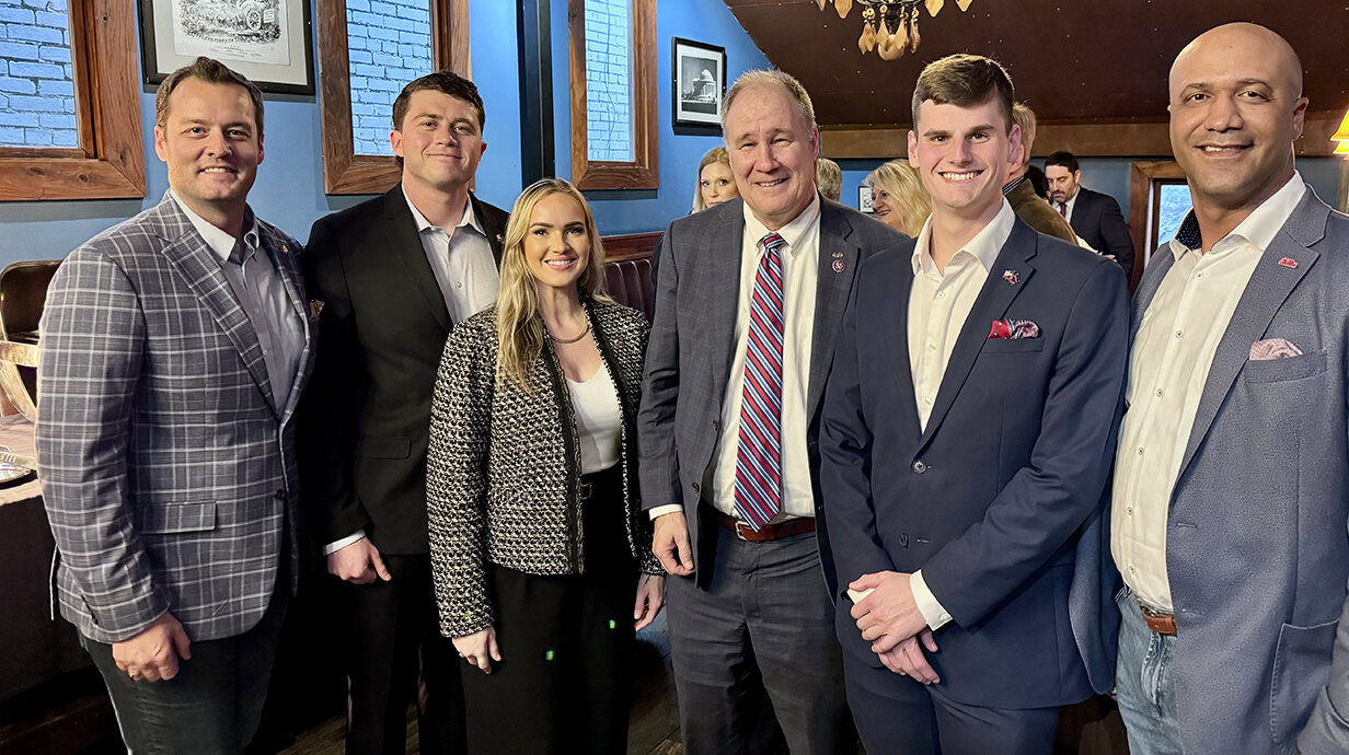 Andrew Newby (left), head of the Office of Veteran and Military Services, Master Sgt. Anthony Douglas (right), VMS operations coordinator, and three members of the Ole Miss Student Veterans Association visit with U.S. Rep. Trent Kelly (center) during a visit to Washington, D.C. Newby and Douglas escorted the three students – Max Hennen (second from left), Taylor Bridges (third from left) and Dylan Neylon (second from right) – on a weeklong tour of the nation’s capital in March. Submitted photo