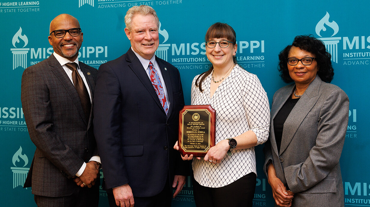 Rebecca Symula (second from right) recognized for work on HHMI inclusive excellence grant