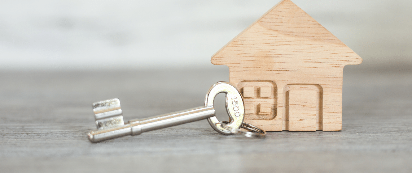 Key on a small wooden house keyring