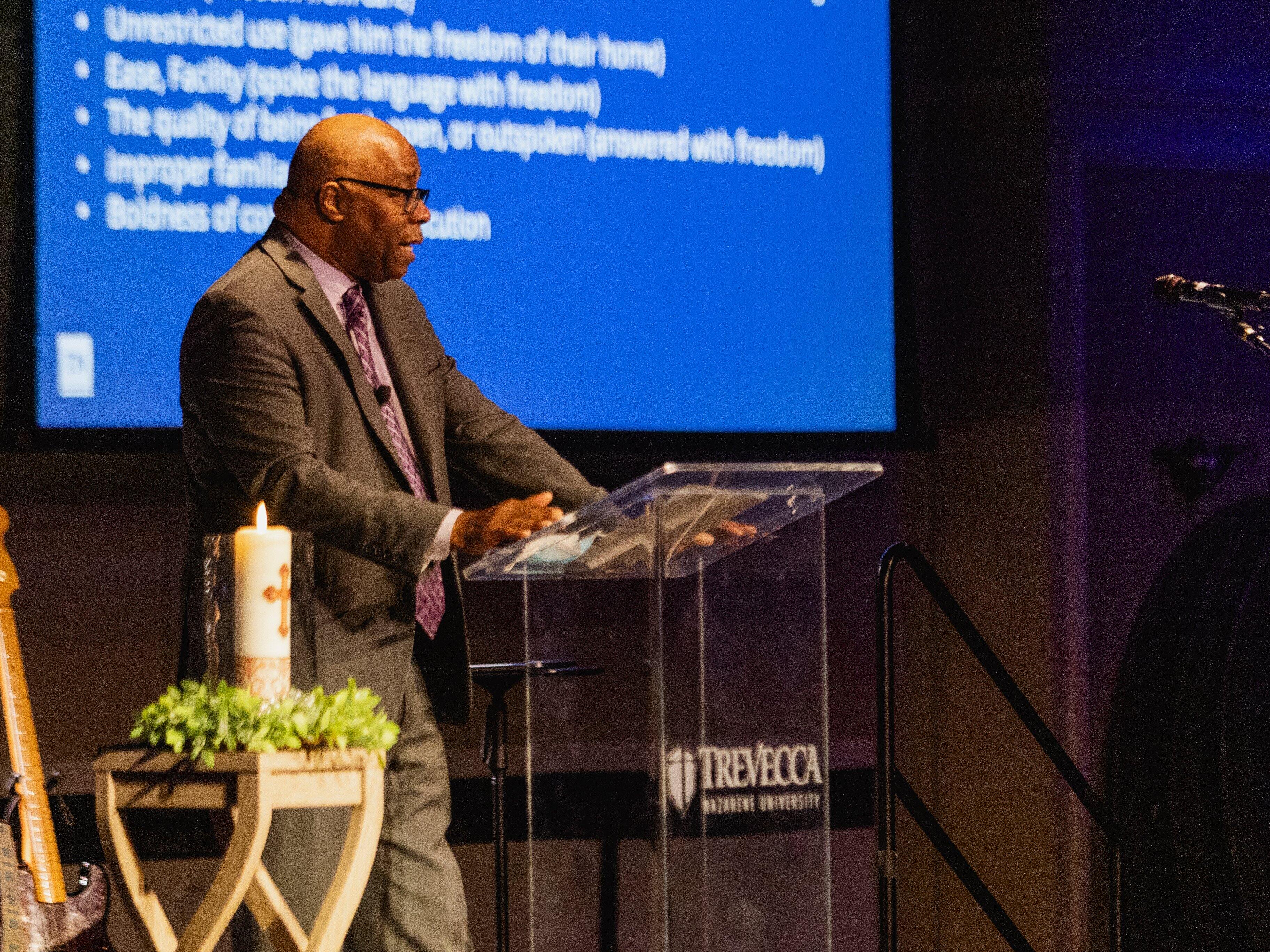 Clarence Carter speaks before an assembly.