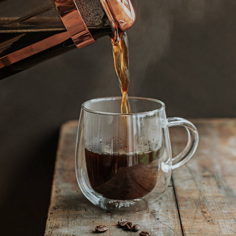 Santos & Java Coffee being poured into a Nova Mug