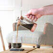 Barista & Co Copper Coffee Press pouring coffee