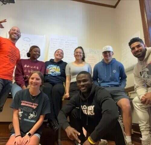 Felix Rosado and his students pose for a photo during one of their Restorative Justice courses.