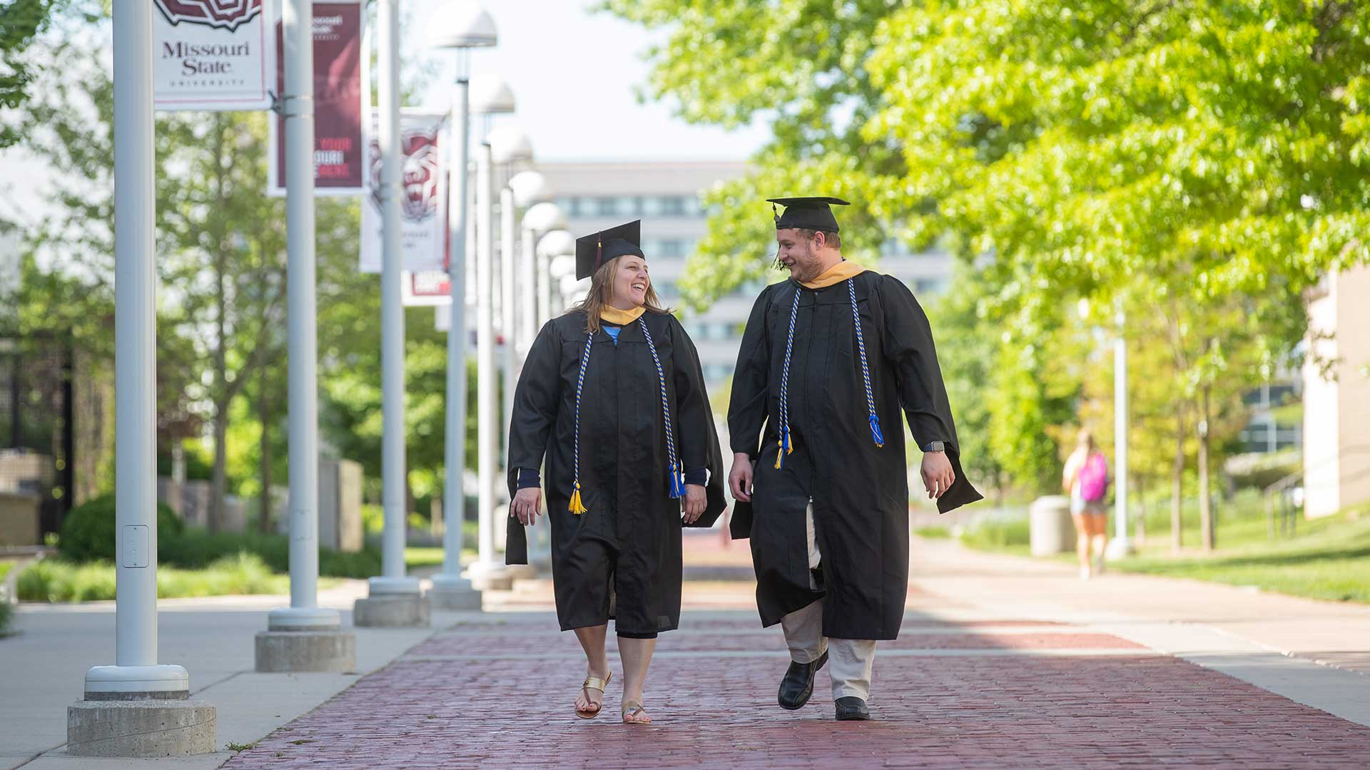 Mother and son, both graduated with master’s degrees