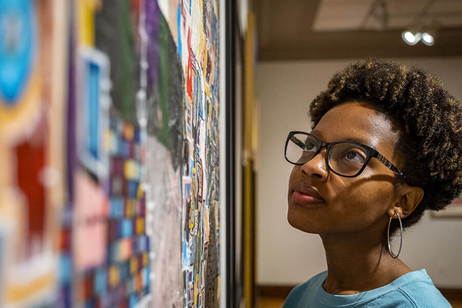 Student looks at mural