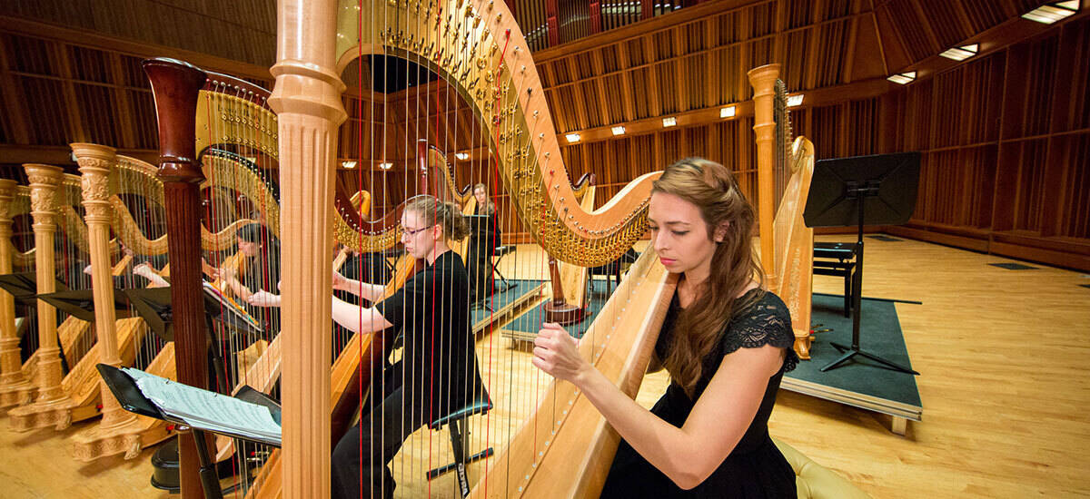 Student Playing Harp