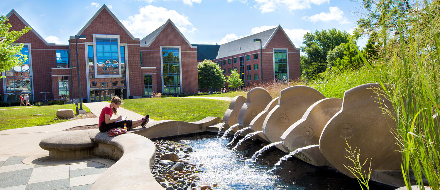 exterior of Dehority Hall including the fish water fountain.