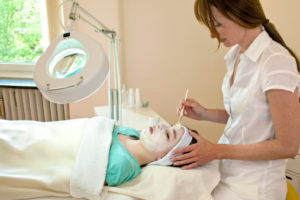 Woman getting chemical peel on her face