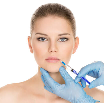 Woman getting fillers cosmetic treatment