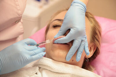 Patient getting fillers in the lips