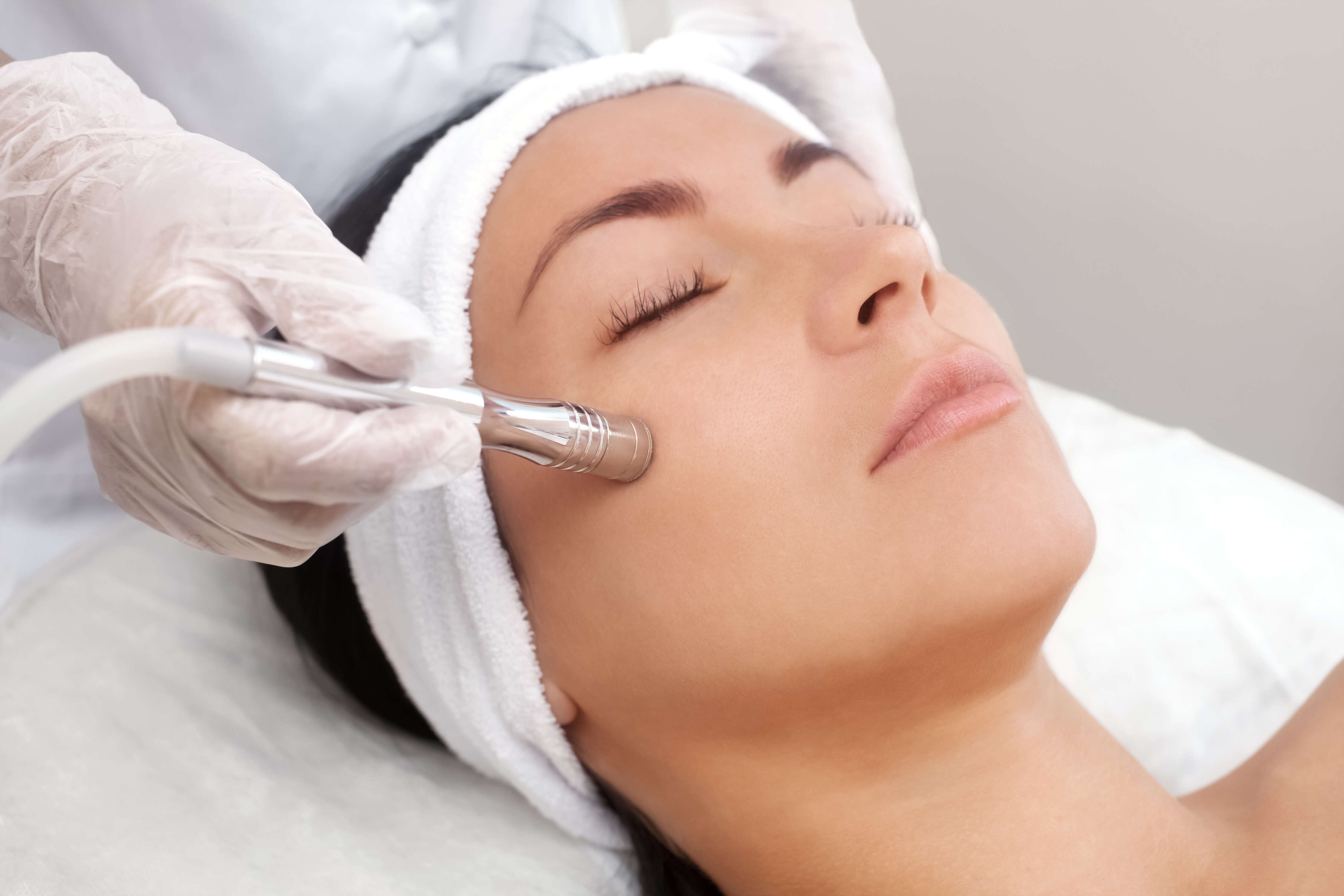 Women getting non surgical skin tightening laser treatment
