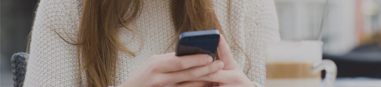 close up of woman's hands holding smartphone_image
