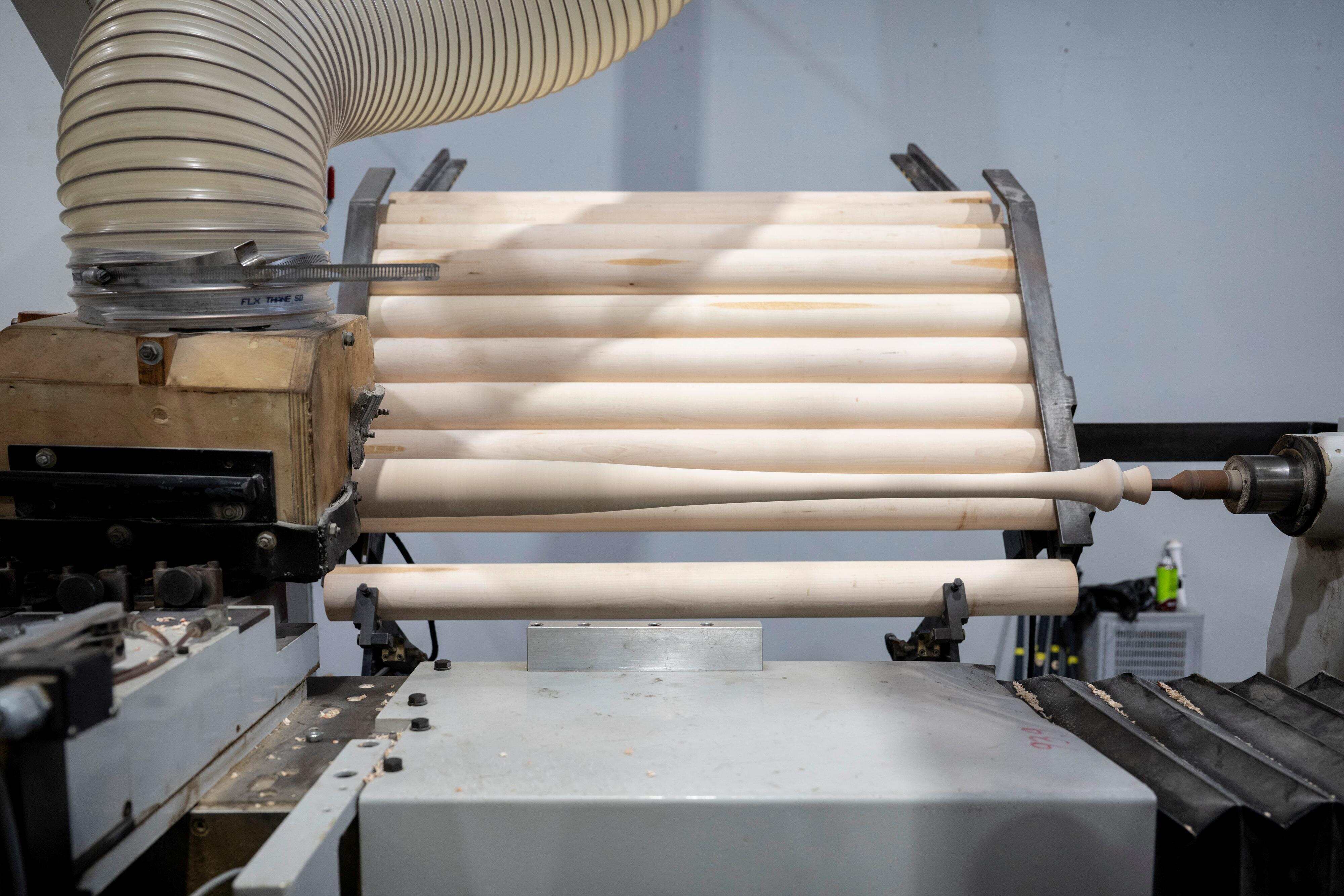 Marucci workers complete the steps of creating a new bat.