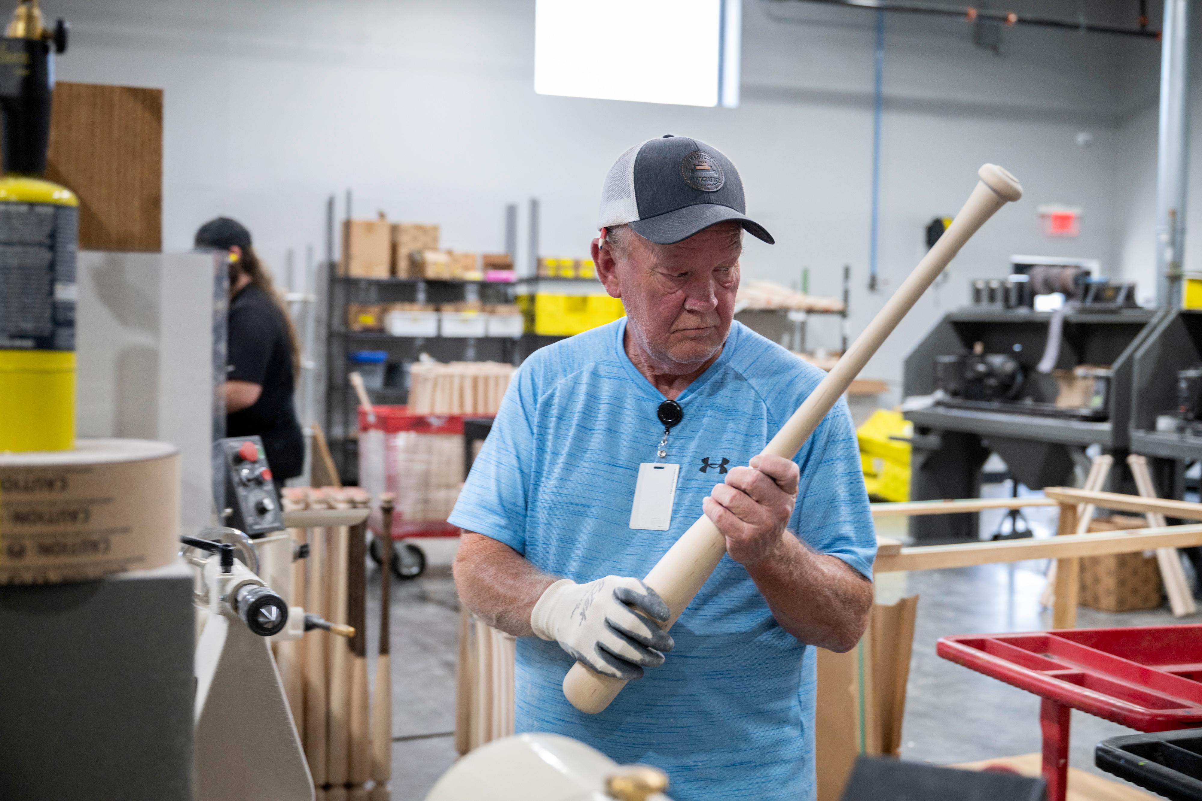 Marucci workers complete the steps of creating a new bat.